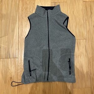 Grey and navy blue fleece vest. No flaws, in perfect condition.